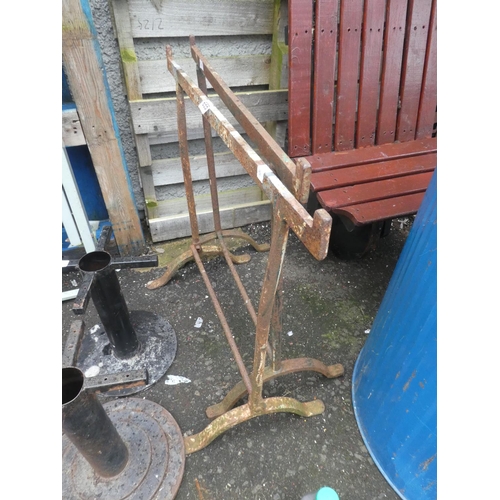 655 - A pair of antique blacksmiths forged trestles.