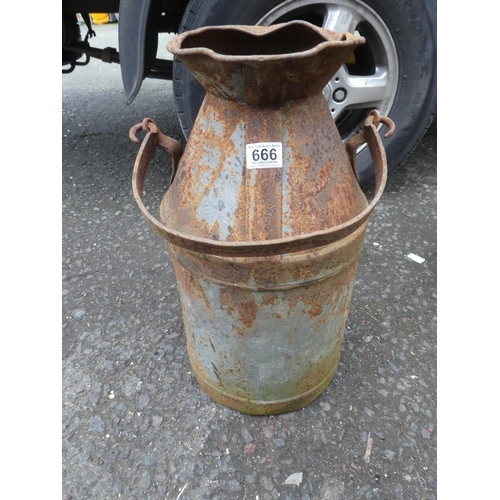 666 - A large vintage container with spout.