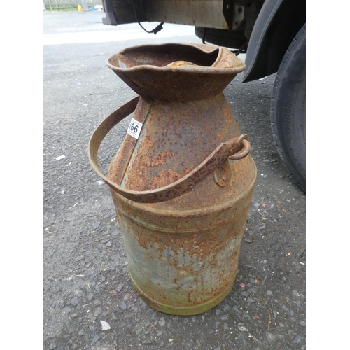 666 - A large vintage container with spout.