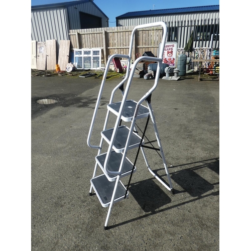 704 - A folding step ladder with handrails.