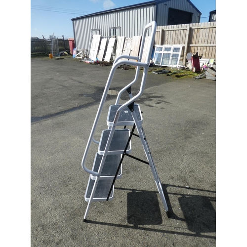 704 - A folding step ladder with handrails.