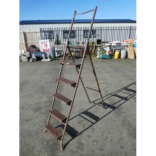 705 - A large metal framed ladder.