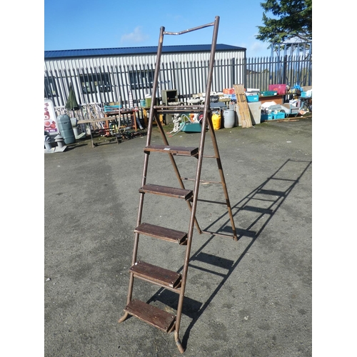 705 - A large metal framed ladder.