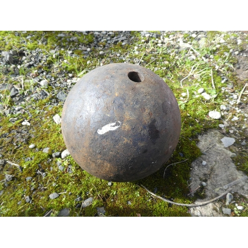 713 - An antique cannon ball