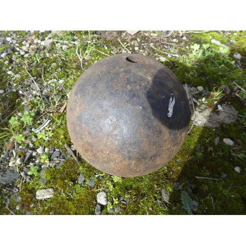 713 - An antique cannon ball