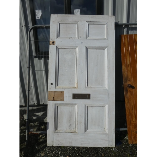 728 - A large vintage wooden door, measuring 211cm x 106cm x 5cm.