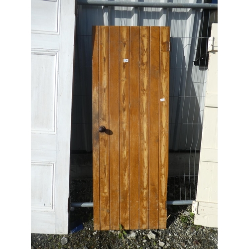 730 - A vintage wooden door, measuring 181cm x 67.5cm x 1cm.