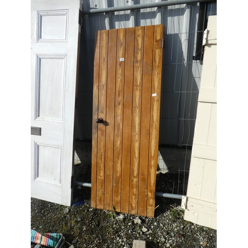 730 - A vintage wooden door, measuring 181cm x 67.5cm x 1cm.