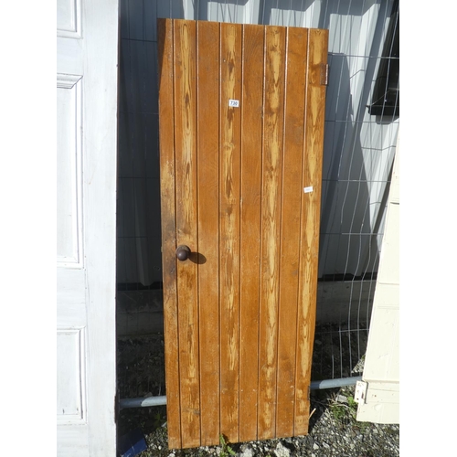 730 - A vintage wooden door, measuring 181cm x 67.5cm x 1cm.