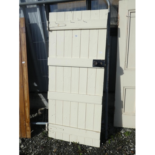 732 - A vintage wooden door painted white, measuring 184cm x 79cm x 1.5cm.