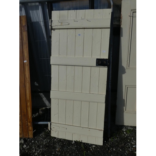 732 - A vintage wooden door painted white, measuring 184cm x 79cm x 1.5cm.