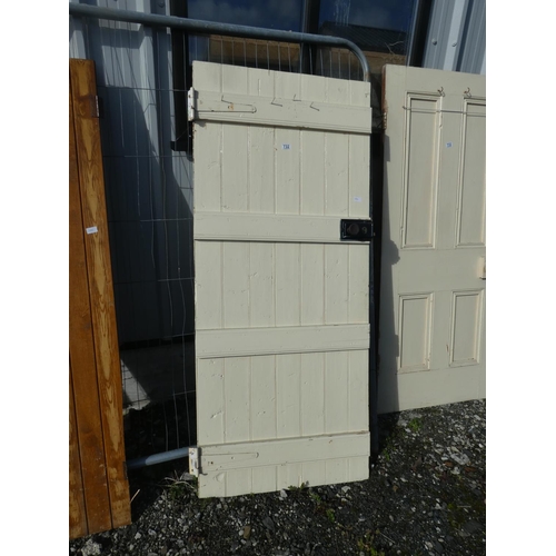 732 - A vintage wooden door painted white, measuring 184cm x 79cm x 1.5cm.