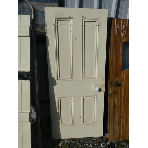 733 - A vintage wooden door painted white, measuring 183cm x 78cm x 4cm.