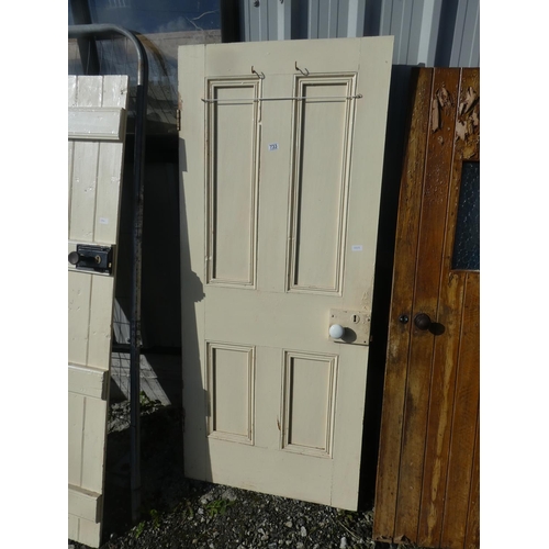 733 - A vintage wooden door painted white, measuring 183cm x 78cm x 4cm.