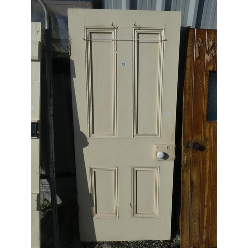 733 - A vintage wooden door painted white, measuring 183cm x 78cm x 4cm.