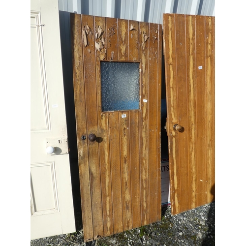 736 - A vintage wooden door with window, measuring 182cm x 75cm x 1cm.