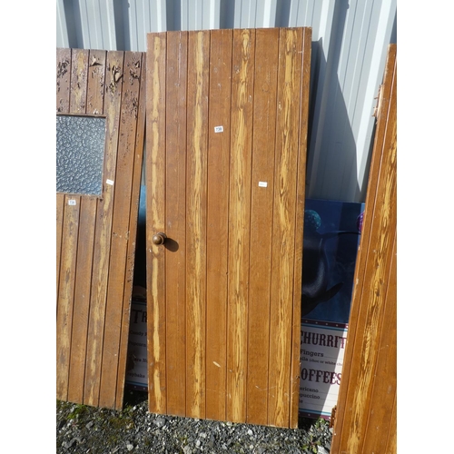 738 - A vintage wooden door, measuring 189cm x 76cm x 2cm.