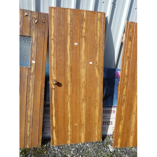 738 - A vintage wooden door, measuring 189cm x 76cm x 2cm.