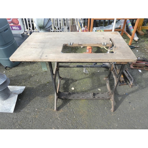 760 - A antique Singer sewing machine base and table.