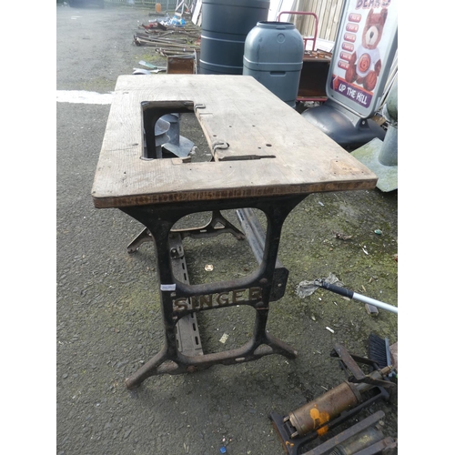 760 - A antique Singer sewing machine base and table.