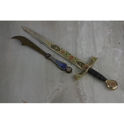 83 - 2 vintage letter openers, modelled as swords.  Approx  15cm.