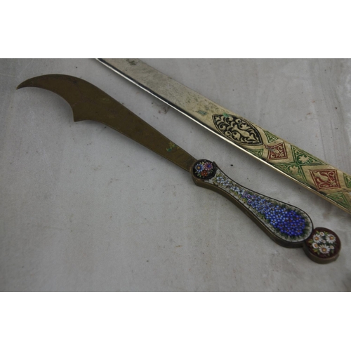 83 - 2 vintage letter openers, modelled as swords.  Approx  15cm.