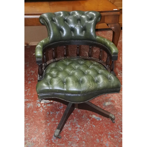 632 - A stunning leather upholstered swivel Captains chair