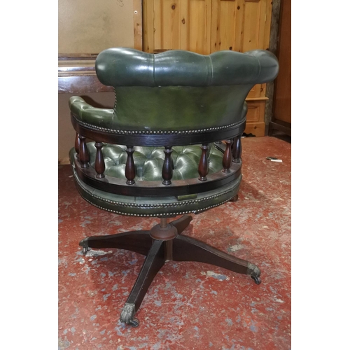 632 - A stunning leather upholstered swivel Captains chair