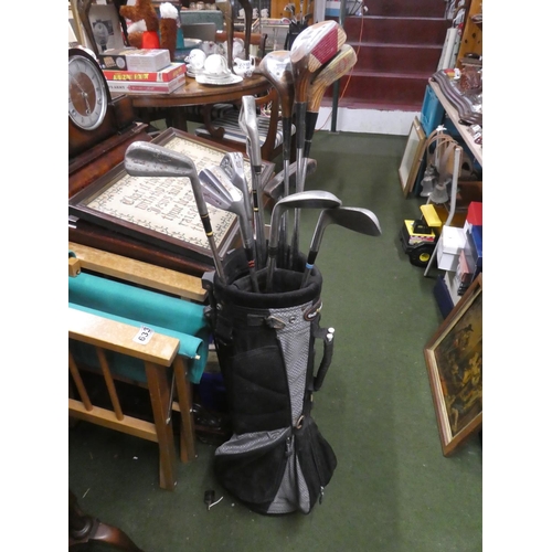 764 - A golf bag containing a lot of assorted clubs to include Wilson, Dunlop and more.