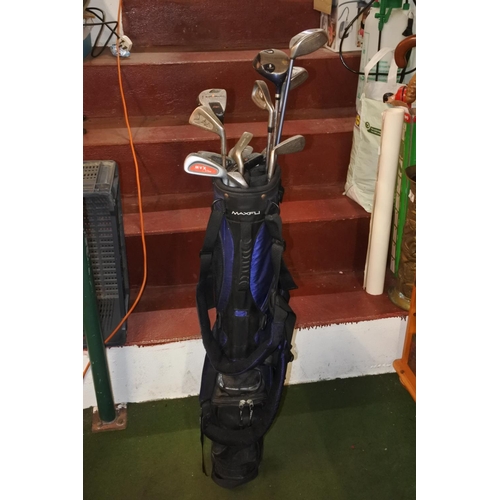 765 - A golf bag and a lot of assorted clubs to include Callaway, Trilogy, Penfold and more.