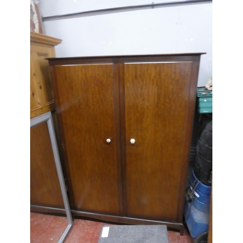 65 - A Stag mahogany two door wardrobe. Approx 70x47x22inches.