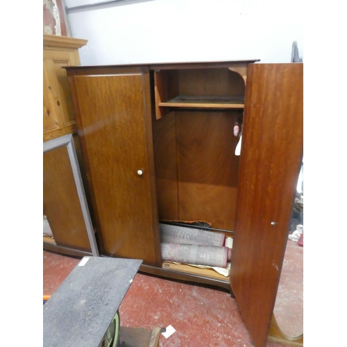 65 - A Stag mahogany two door wardrobe. Approx 70x47x22inches.