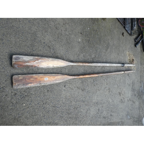 693 - Two large wooden oars.  Approx 300cm long.