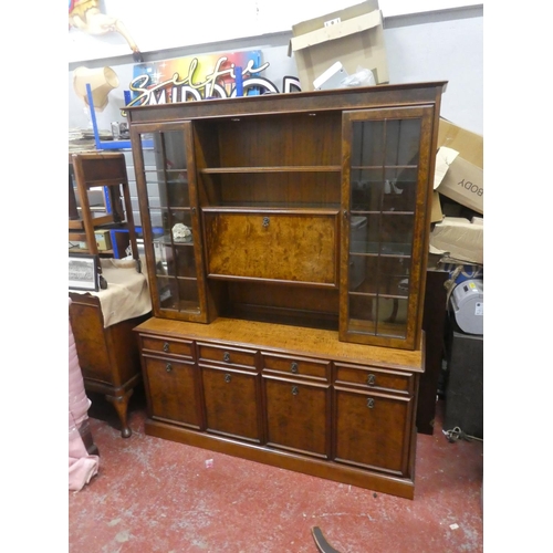 726 - A stunning walnut effect display cabinet with light up display panel. Approx 190x158x45cm.