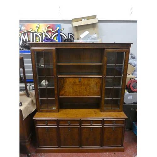 726 - A stunning walnut effect display cabinet with light up display panel. Approx 190x158x45cm.