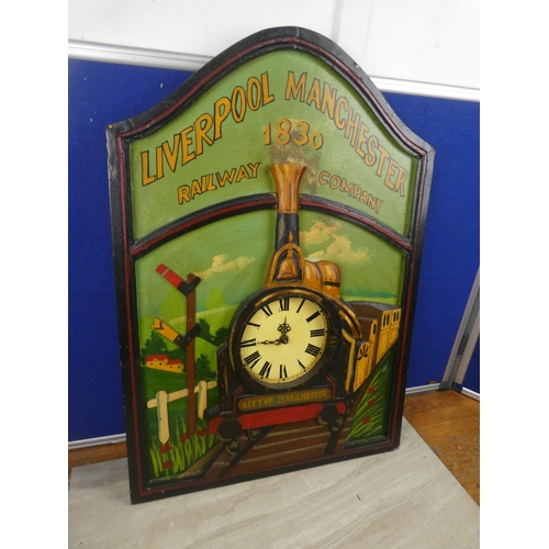 67 - A decorative wooden clock in the style of a train 'Liverpool Manchester Railway Company'.