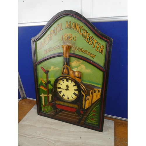 67 - A decorative wooden clock in the style of a train 'Liverpool Manchester Railway Company'.