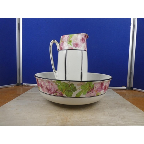 70 - A stunning antique Royal Doulton floral patterned jug and wash bowl set.