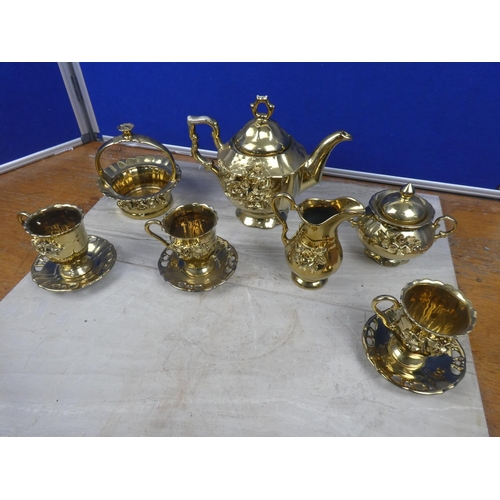 77 - A ceramic pottery coffee set with gilt detail.