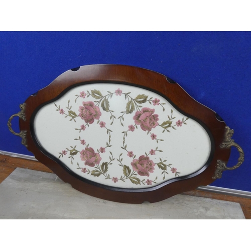 78 - A two handled serving tray with needlework panel.