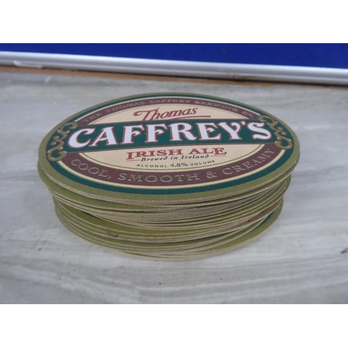 84 - A lot of Caffrey's coasters.