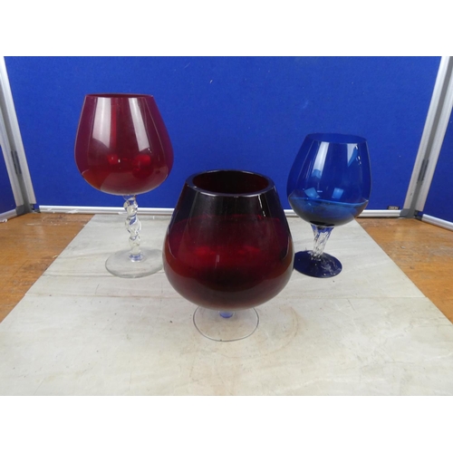 87 - Three vintage coloured goblet vases.