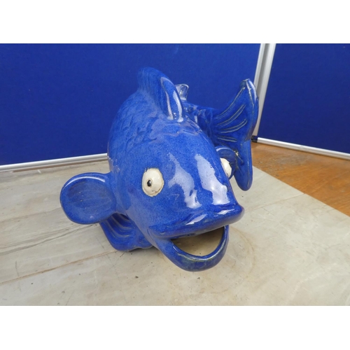 90 - A stunning blue glazed vase in the style of a fish.