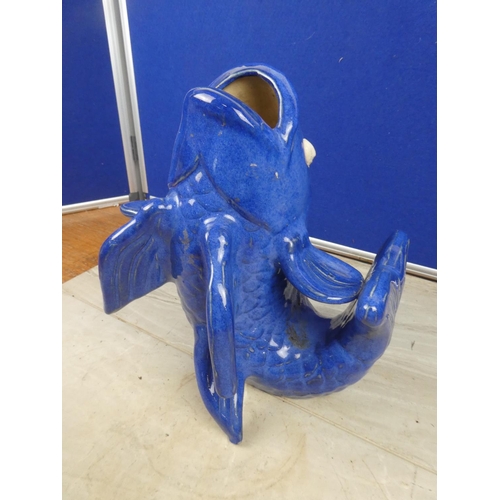 90 - A stunning blue glazed vase in the style of a fish.