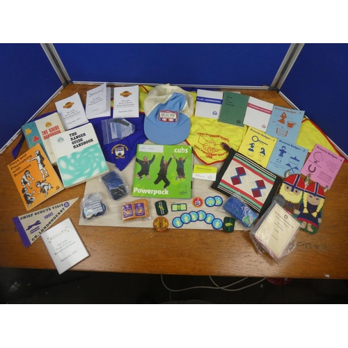 210 - A large collection of Scout's and Brownie's leaflets, badges, flags and more.