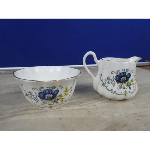 223 - A Royal Tara bone china 'Tara Hall' milk jug and sugar bowl.