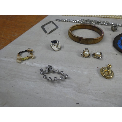 224 - A large job lot of various jewellery, bangles, bottle opener, whistle and lots more.