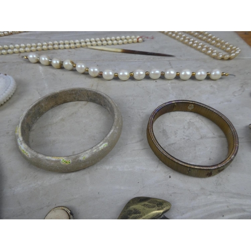 224 - A large job lot of various jewellery, bangles, bottle opener, whistle and lots more.