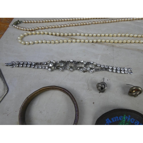 224 - A large job lot of various jewellery, bangles, bottle opener, whistle and lots more.