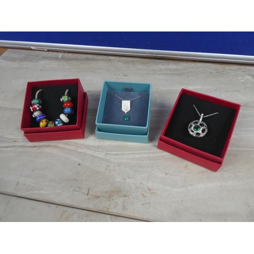 249 - Three necklaces in presentation boxes.